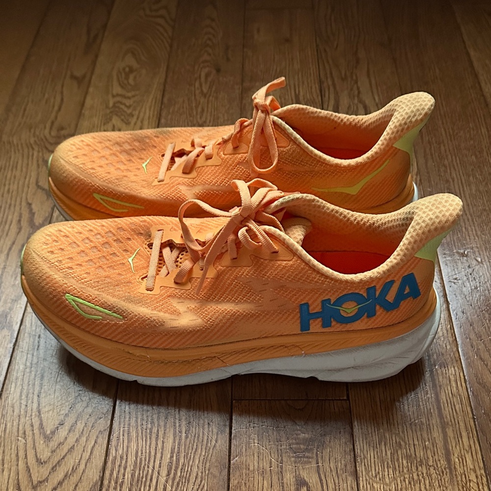 Hoka Orange Athletic Running Shoes with Blue Logo